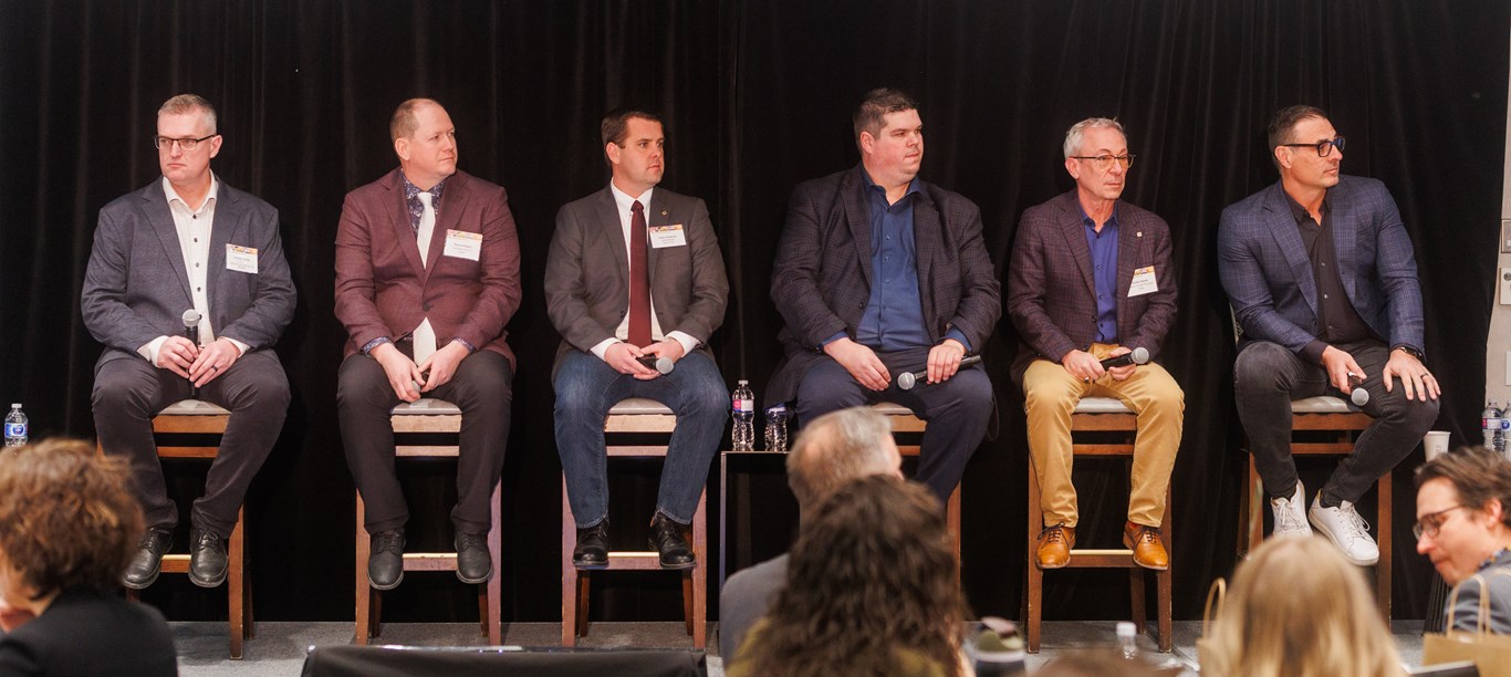 Players from the biofuels industry sitting on stage participating in a panel titled, Agriculture: The Key to Unlocking Biofuels. 
