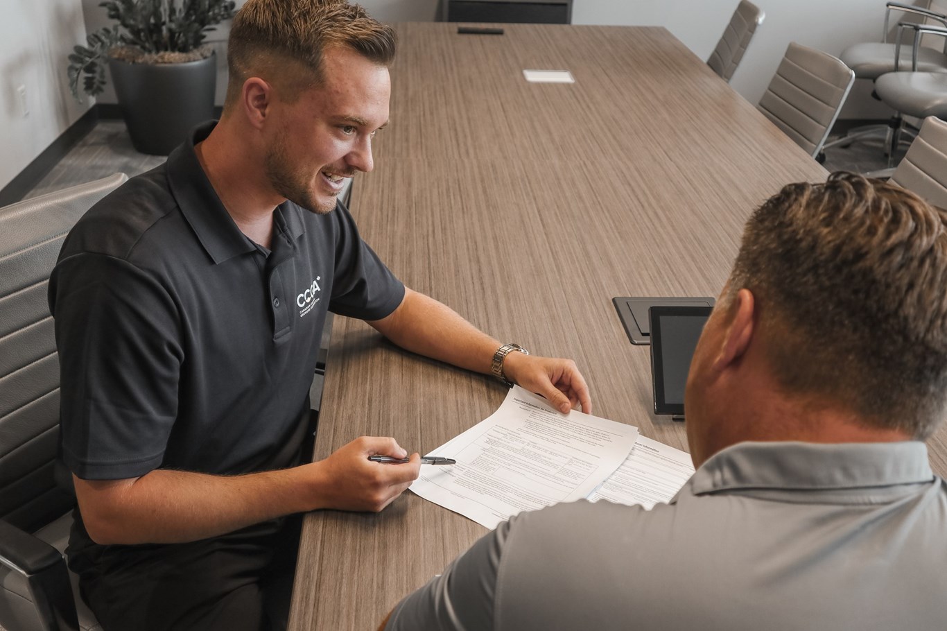 Image of CCGA employee working with a farmer